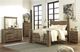 Signature Design by Ashley® Trinell Brown Queen Poster Bed-1