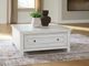 Signature Design by Ashley® Robbinsdale Antique White Lift-Top Cocktail Table-1