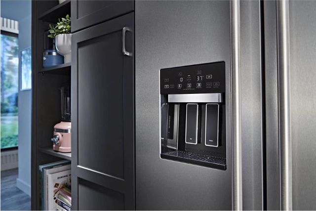 close view of a built in refrigerator sitting flush with cabinetry