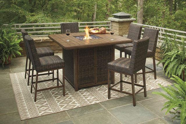 Front view of a modern outdoor dining area with a fireplace table and six chairs around it