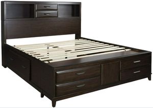 Front view of the Benchcraft® Vanmore 4-Piece Dark Brown Queen Storage Bedroom Set