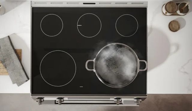 Scraping Glass Cooktop with Razor
