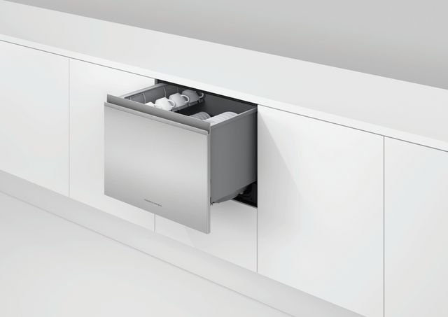 Front view of a white cabinet and counter with an opened stainless steel Fisher and Paykel DishDrawer