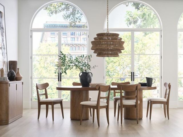 Credit: aspenhome Front view of a modern dining room with a wooden dining table set for 6