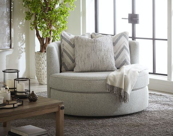 A comfortable swivel armchair in a living room setting