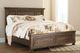 Signature Design by Ashley® Flynnter Medium Brown California King Panel Storage Bed-1