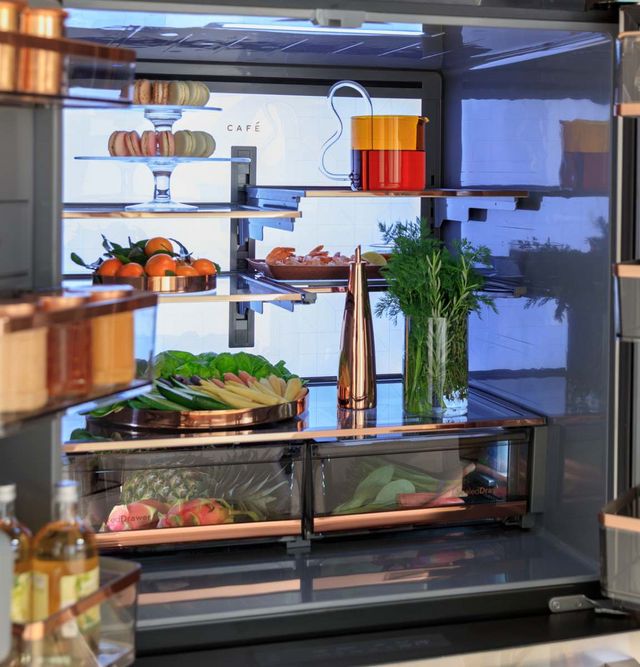 Front view of the inside of a Cafe counter depth refrigerator, stocked with thoughtfully places ingredients