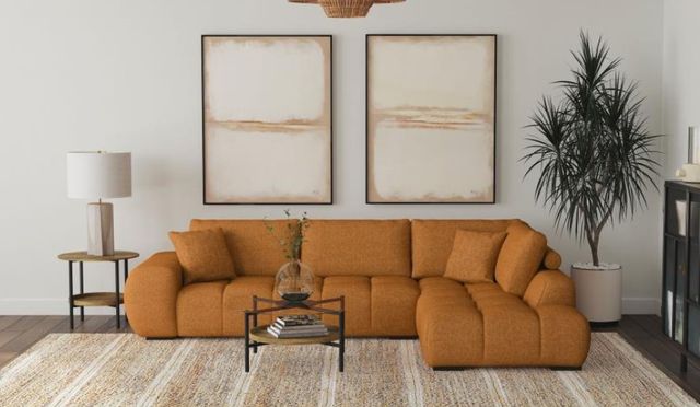 front view of the Coaster® Camacho 2-Piece Orange Upholstered Chaise Sectional Sofa in a modern living room with white walls and two tone furniture