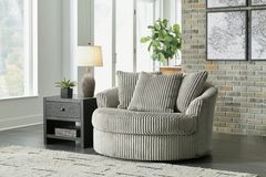 Signature Design by Ashley® Lindyn Fog Swivel Accent Chair