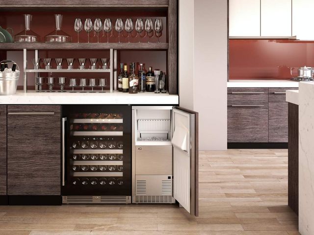 Front view of a modern bar area with an under counter refrigerator and ice maker