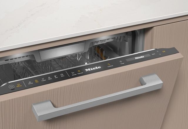 Close view of a panel ready Miele dishwasher with top controls