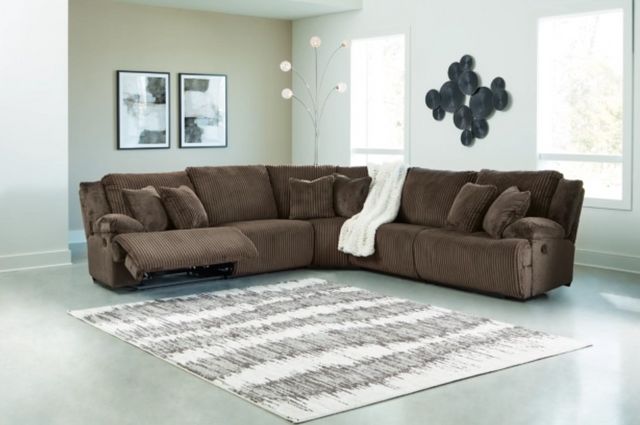 front view of a modern living room with a brown curved sectional