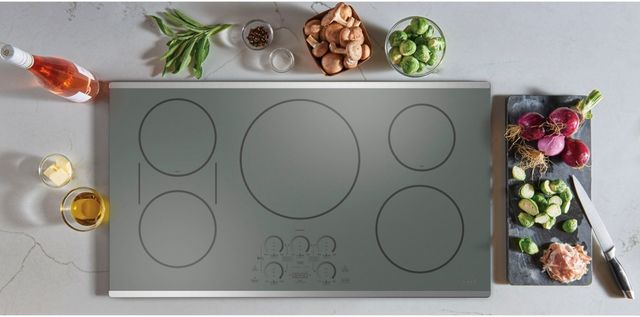 Top view of various ingredients sitting around a Cafe induction cooktop