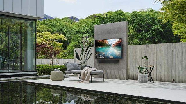 Samsung The Terrace Outdoor TV on a modern patio