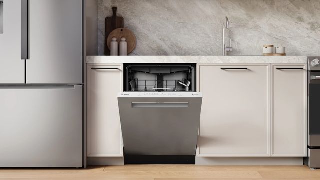 Interior view of a Bosch dishwasher with the 3rd rack pulled out