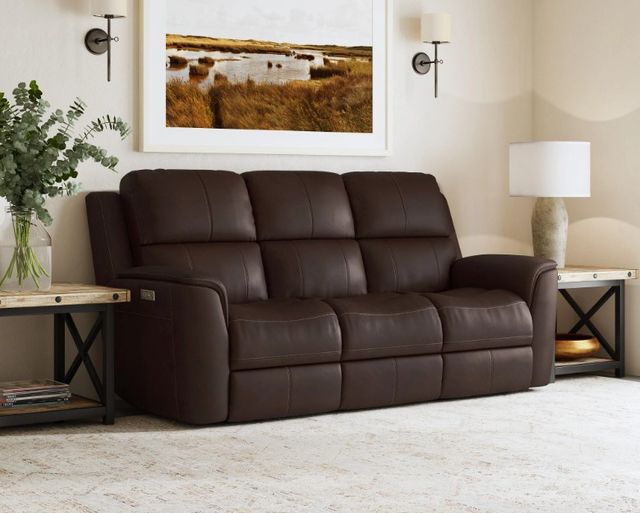 front view of a casual living room with a leather flexsteel sofa with power headrests