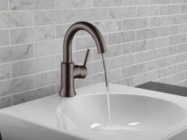 Delta Trinsic® Venetian Bronze Single Handle High-Arc Bathroom Faucet with Drain-1