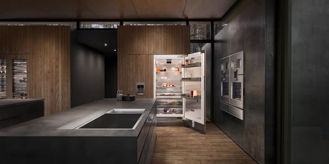 Front view of a contemporary kitchen with an opened Gaggenau refrigerator