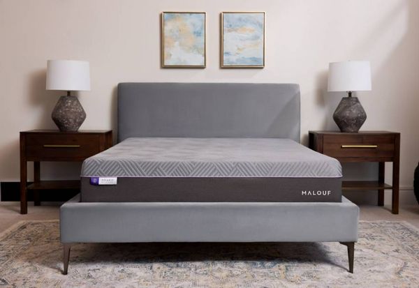 front view of a modern minimalist bedroom with a malouf mattress on a grey bed frame