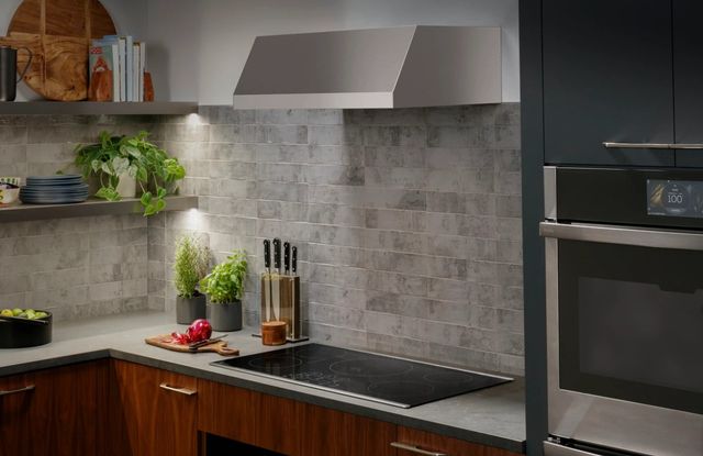 Credit: GE Profile Front view of a modern kitchen with a GE Profile induction cooktop