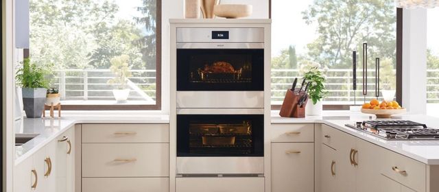 Front view of a Wolf double wall oven in a modern kitchen