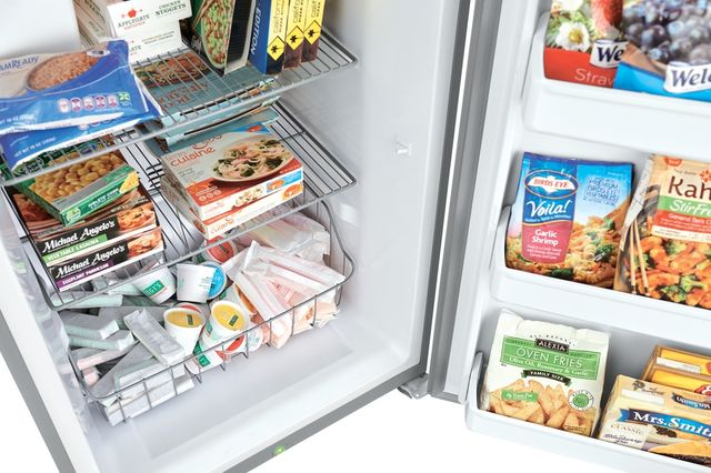 Opened Frigidaire upright freezer storage Opened Frigidaire upright freezer storage