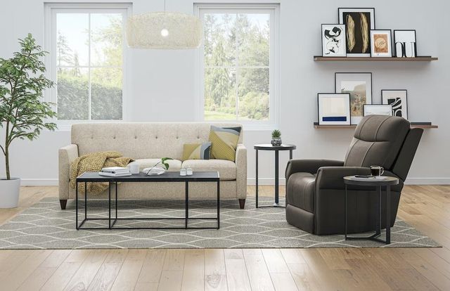 Front view of a casual living room with white walls, a beige sofa, and a brown Flexsteel lift recliner.
