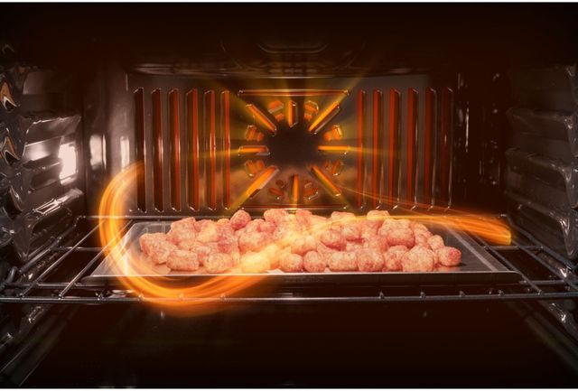 Credit: GE Close view of tater tots cooking inside a GE double wall oven