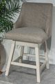 Signature Design by Ashley® Robbinsdale Antique White Upholstered Swivel Bar Stool-1