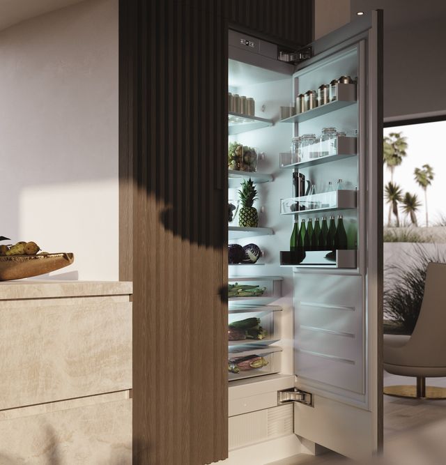 Front view of a Monogram 24 inch refrigerator in a luxury kitchen