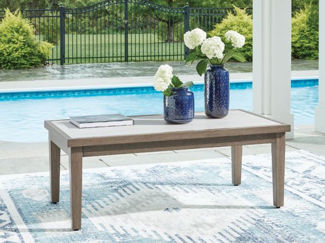 Signature Design by Ashley® Rainier Ranch Beige Aluminum/Stone Outdoor Coffee Table with Brown Base-3
