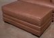 Benchcraft® VillaCourt Caramel Ottoman-1