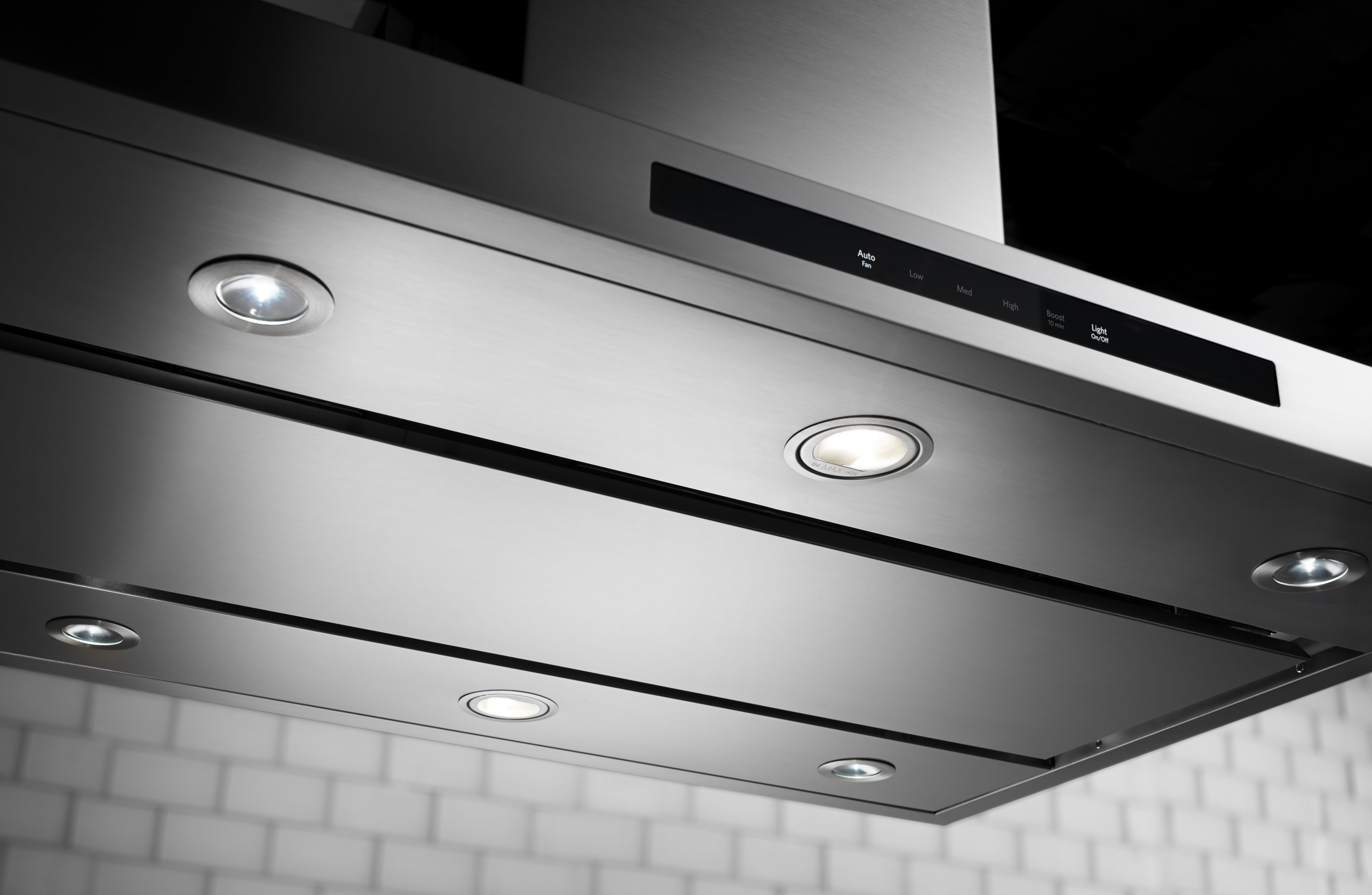 Kitchen range hood Kitchen range hood above a gas stove in a modern kitchen