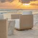 Uttermost® Santorini Honey/Oyster White Wicker Indoor-Outdoor Swivel Lounge Chair with Cushion-1