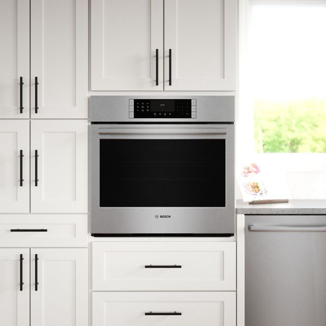 Credit: Bosch Front view of a modern kitchen with a single Bosch wall oven