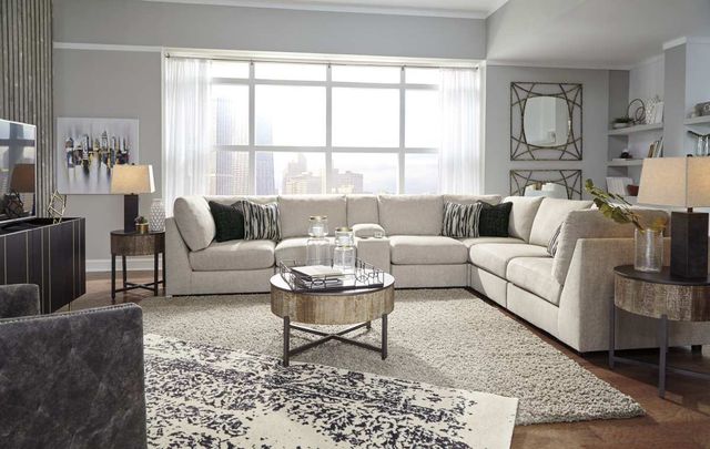 front view of a modern living room with a beige sectional sofa