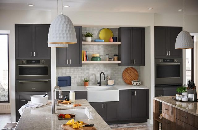 Front view of a modern kitchen with Black Ore kitchenAid appliances
