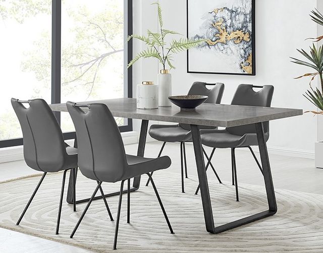 front view of a small modern dining room with a grey rectangular table and four grey chairs