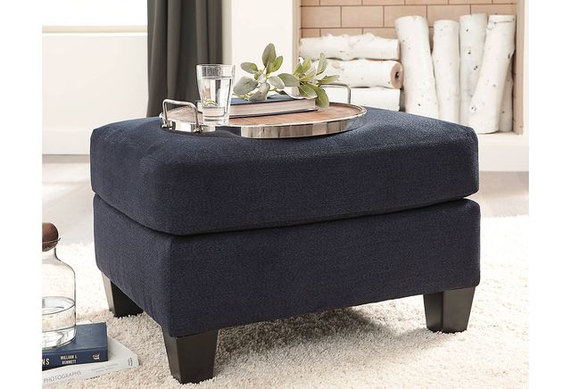 Benchcraft® Creeal Heights Ink Ottoman-1