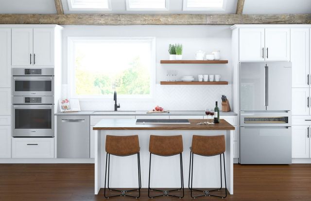 Front view of a modern kitchen with white cabinetry and Bosch appliances