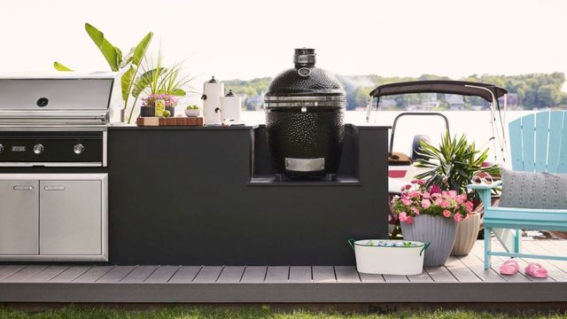 front view of a Lynx Kamado grill and smoker in a modern outdoor kitchen space