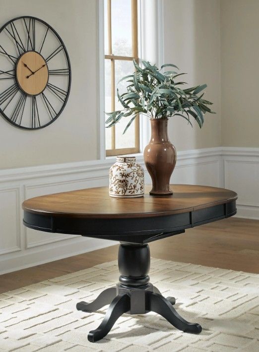 Signature Design by Ashley® Clorazi Brown Oval Dining Table with Black Base-1