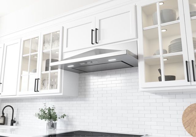 view of a modern kitchen with an under the cabinet ductless range hoods