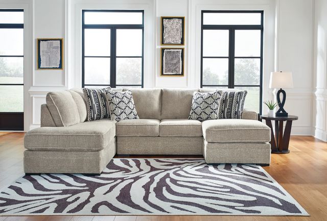 front view of a small beige u-shaped sectional sofa in a modern living room
