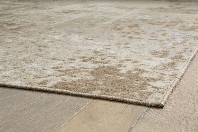 Signature Design by Ashley® Grifflain Tan/Brown/Gray 5'x7' Area Rug-1