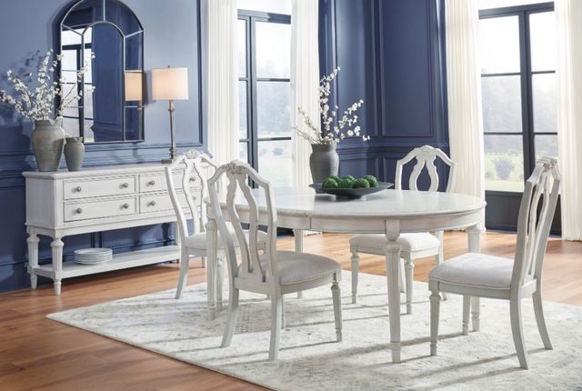 Front view of a modern dining room with a Benchcraft farmhouse dining room set