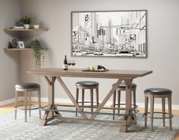 A rustic bar height dining table set in an entertainment space A rustic bar height dining table set in an entertainment space