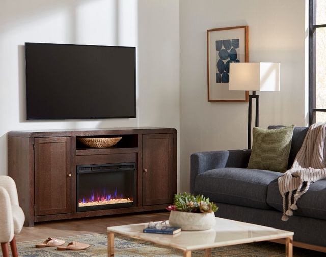 Front view of a mid-century modern style living room with a media console and TV mounted above it
