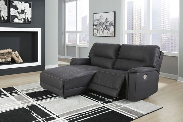 Living room with a sofa with chaise and recliner
