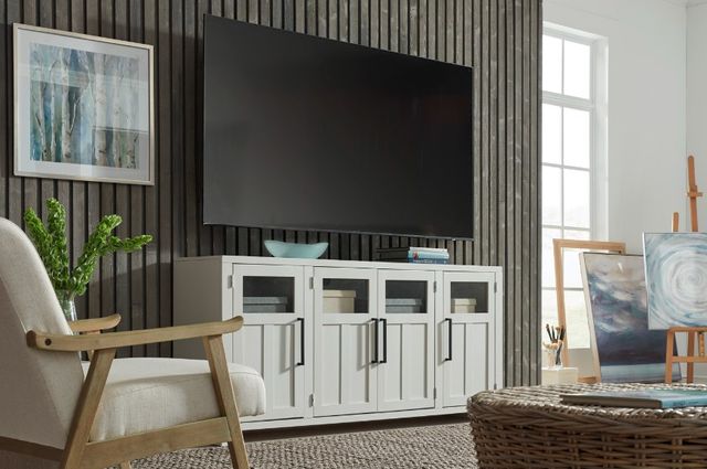 Angled view of a modern living room with an aspenhome console and wall mounted TV